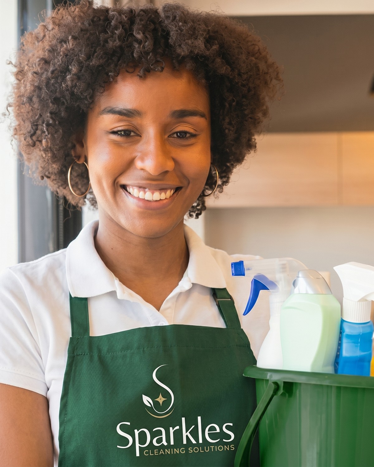 A Sparkles cleaner at work with the premium product kit included in every clean