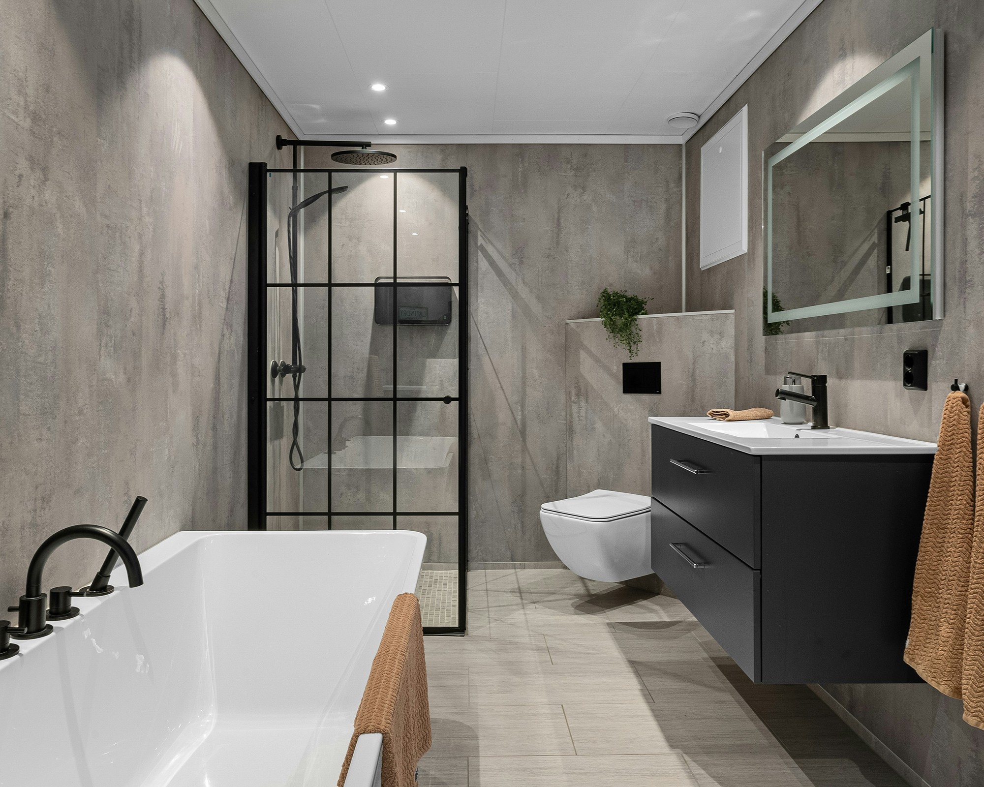 A spotless bathroom with polished taps and fresh towels