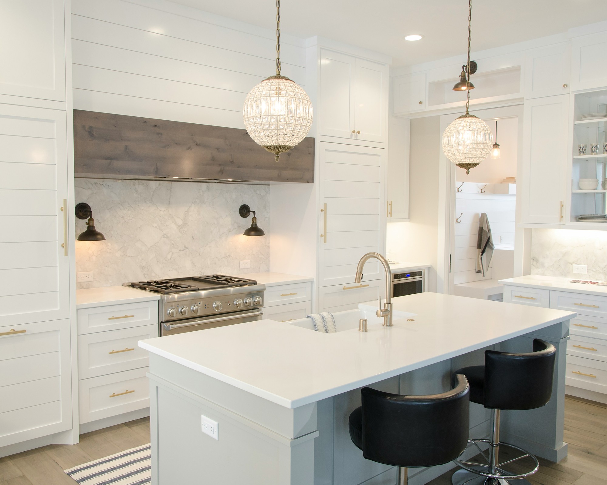 A gleaming white kitchen with clear worktops after a Sparkles clean